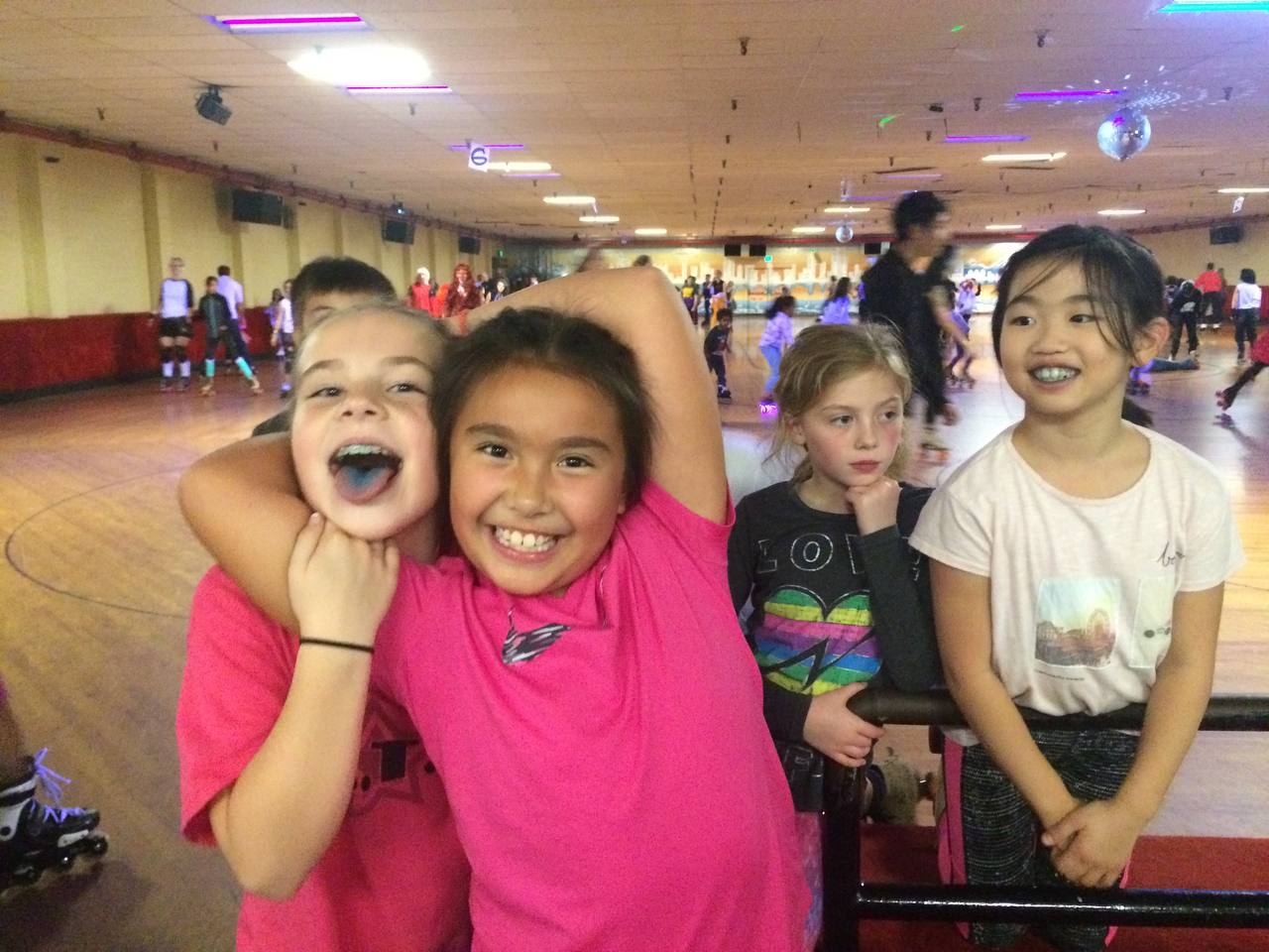 Claire and friends being goofy at the roller rink